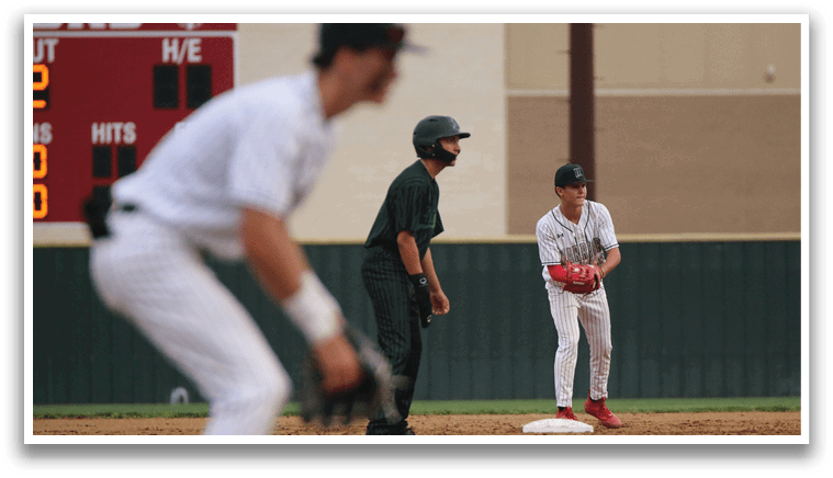A baseball player is standing on the field with a baseball glove. Description generated by AI