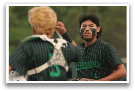 A baseball player wearing a black shirt and green pants. Description generated by AI