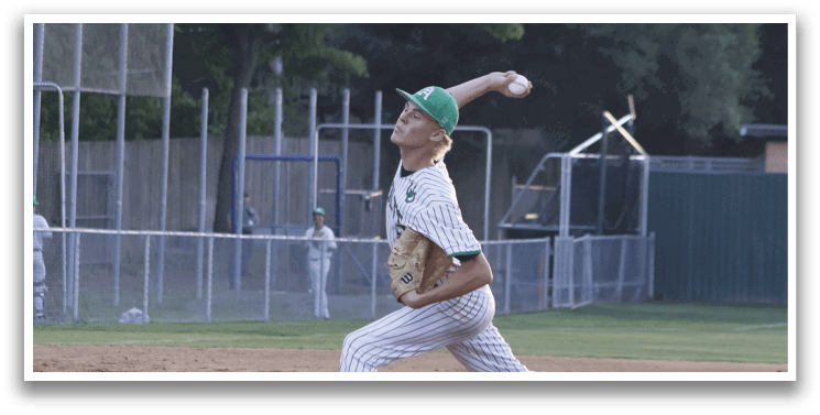 A boy wearing a striped shirt running on a baseball field. Description generated by AI