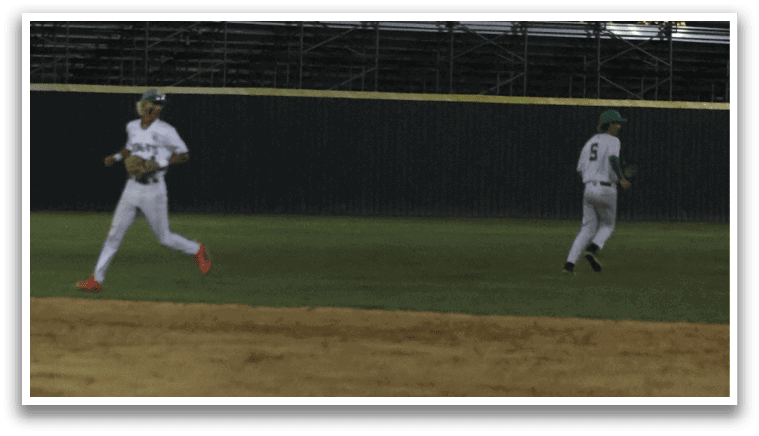 Two baseball players running on a field. Description generated by AI