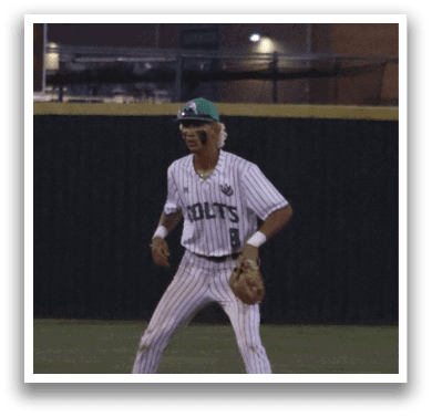 A baseball player in a white uniform is running on the field. Description generated by AI