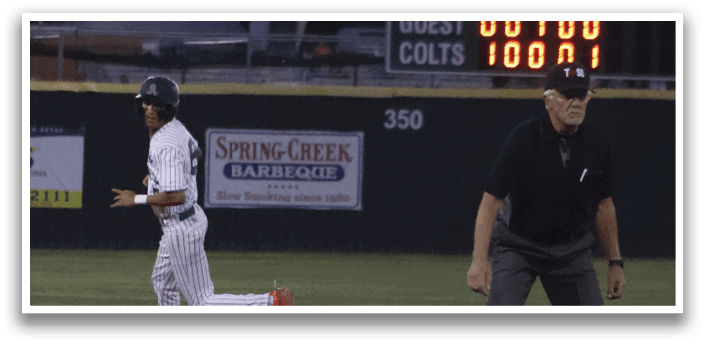 A baseball player is running to first base. Description generated by AI