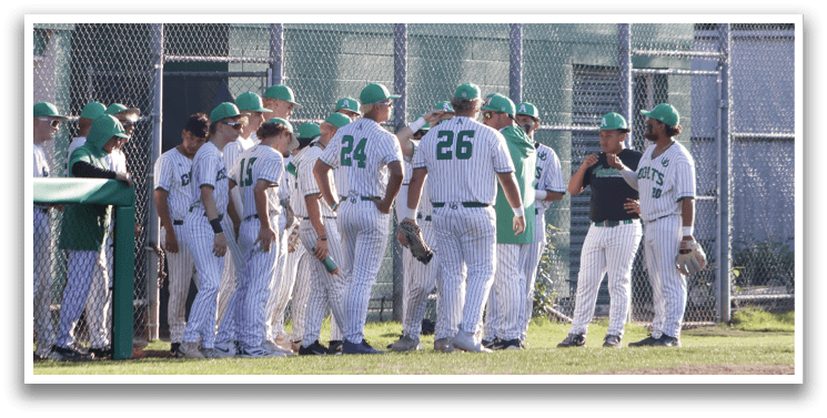 A group of baseball players wearing green and white uniforms. Description generated by AI