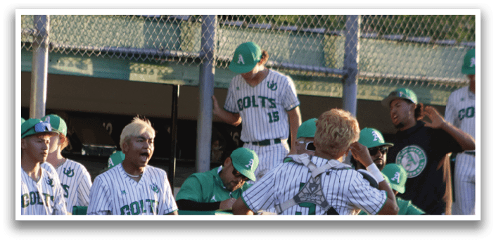 A group of people wearing green and white uniforms. Description generated by AI