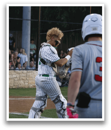 A baseball player in a grey and white uniform is swinging a bat. Description generated by AI