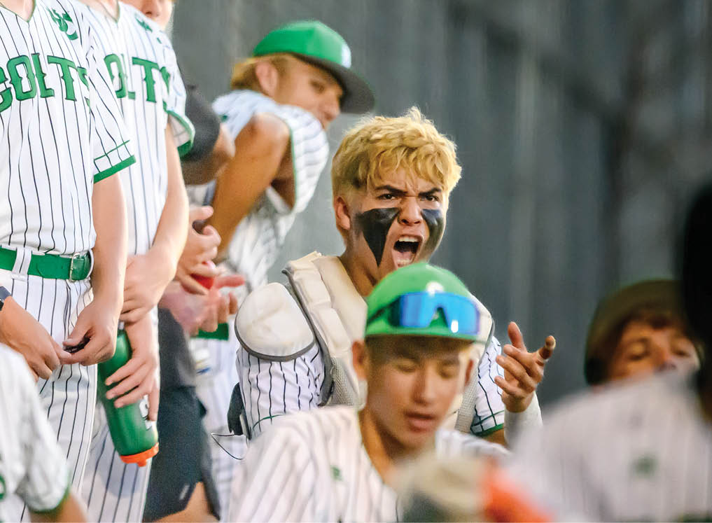 A group of people wearing green and white uniforms. Description generated by AI