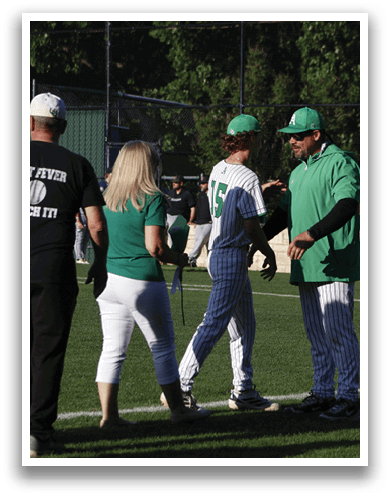 A man wearing a baseball uniform walks on a field. Description generated by AI