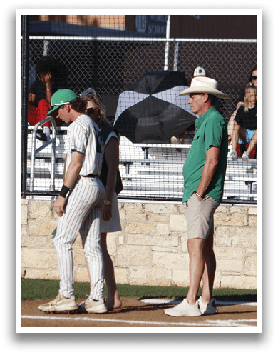 A man and woman standing on a baseball field. Description generated by AI