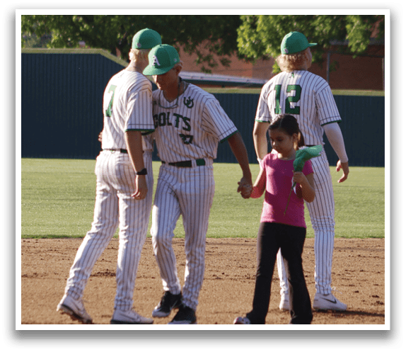 A group of baseball players standing in a line. Description generated by AI