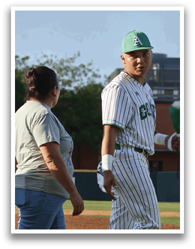 A man wearing a baseball uniform. Description generated by AI