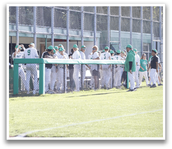 A group of baseball players standing in a line. Description generated by AI