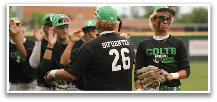 A group of baseball players wearing green and black uniforms. Description generated by AI