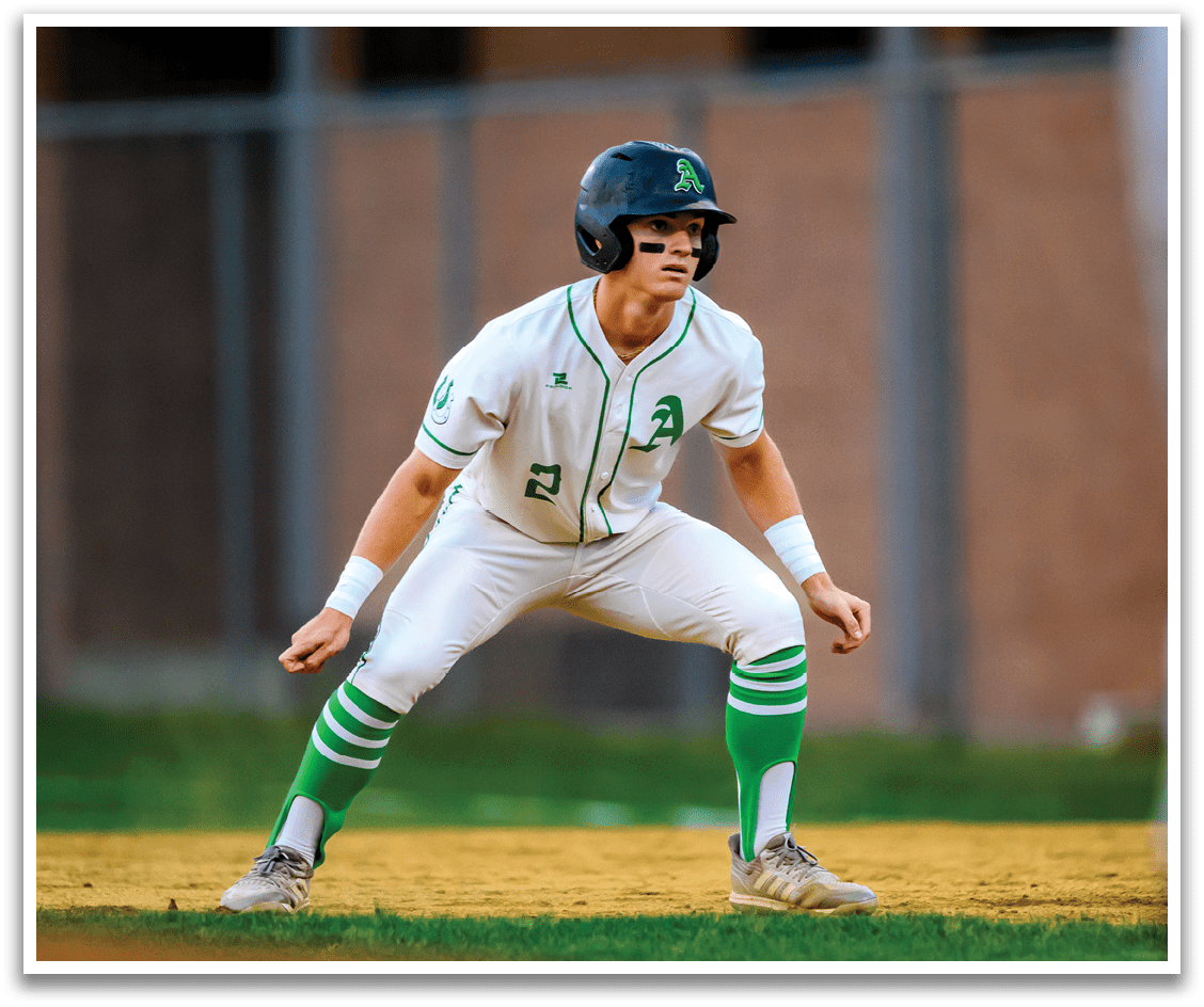 A baseball player wearing a green and white uniform. Description generated by AI