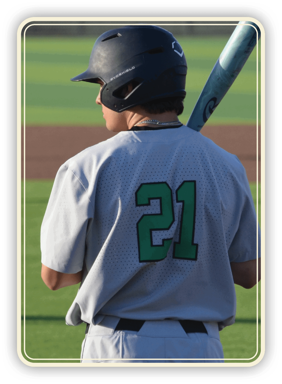 A baseball player in a grey uniform with the number 21 on the back is holding a bat and waiting for his turn to bat. AI generated content