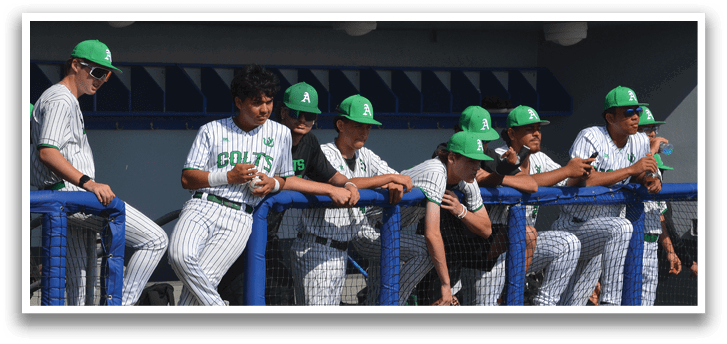 Baseball players wearing green hats and white uniforms sitting on a bench. AI generated content