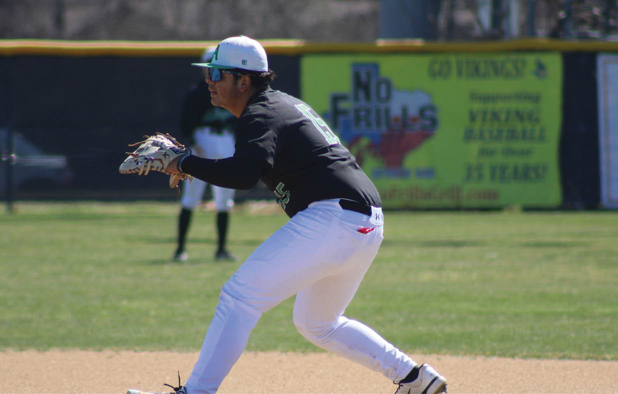 A baseball player in a black shirt and white pants is swinging a bat on a field. AI generated content