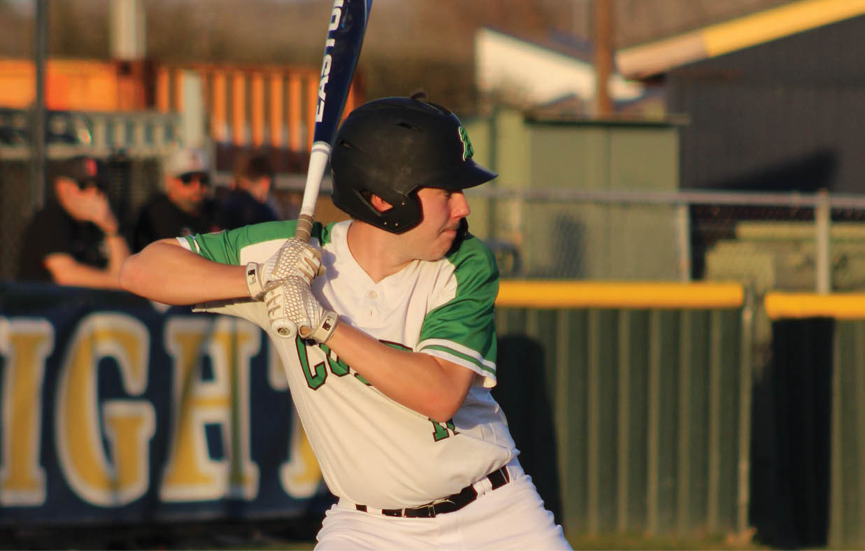 A baseball player in a white uniform is swinging a bat, preparing to hit the ball. AI generated content