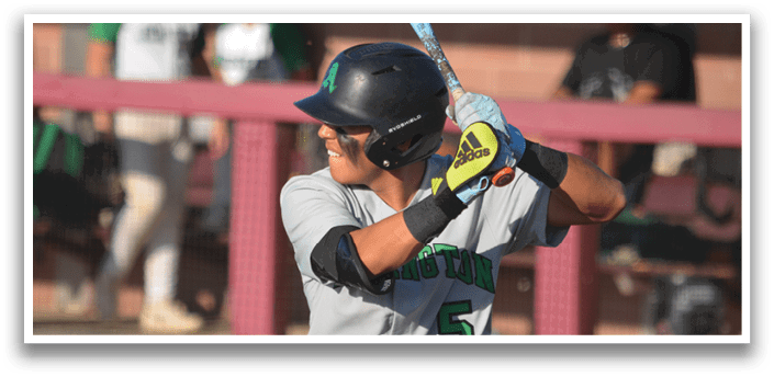 A baseball player in a grey uniform is swinging a bat, preparing to hit the ball. AI generated content