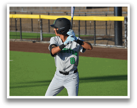 A baseball player in a grey uniform is holding a bat and getting ready to swing. AI generated content