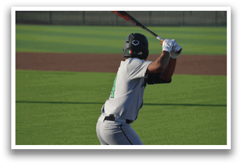A baseball player is swinging a bat on a field, preparing to hit the ball. AI generated content