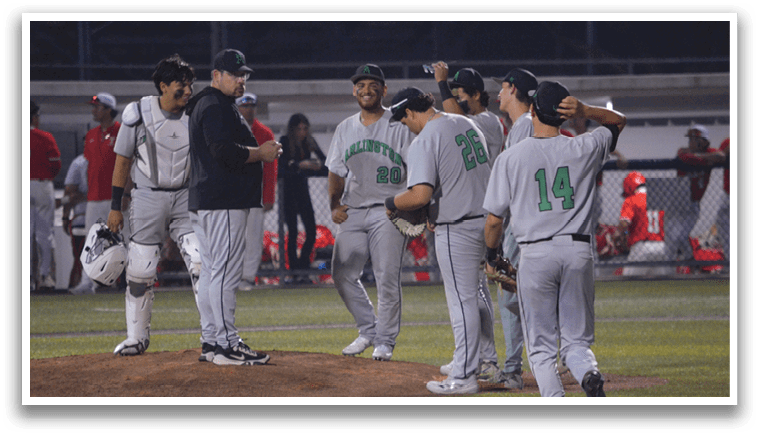 Baseball players wearing grey uniforms are standing on a field, talking and laughing with each other. AI generated content