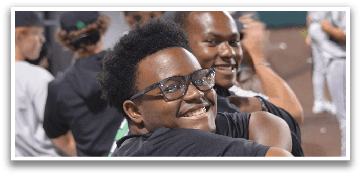 A young man wearing glasses is holding a green tube. AI generated content