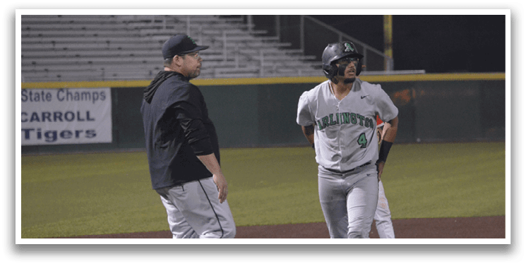 A baseball player wearing a green shirt and grey pants is walking on the field. AI generated content