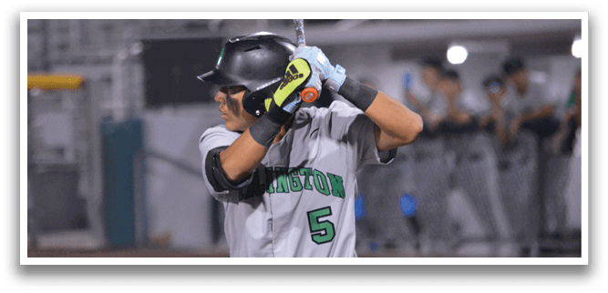 A baseball player in a grey uniform is swinging a bat, ready to hit the ball. AI generated content