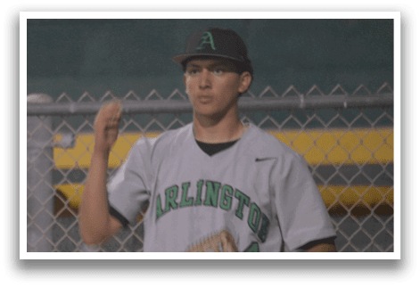 A baseball player wearing a grey jersey with the letter A on it stands on a field. AI generated content