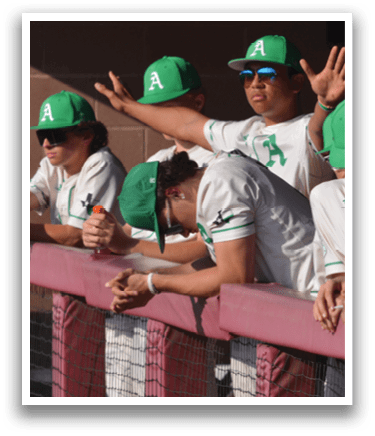 A group of baseball players wearing green hats and shirts are sitting on a bench. AI generated content