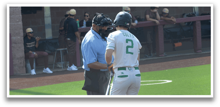 A baseball player wearing a green and white uniform is walking on the field. AI generated content