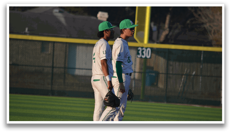 Two baseball players standing on the field, one wearing a green hat and the other wearing a white hat. AI generated content