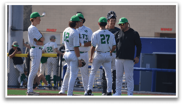 A group of baseball players wearing green and white uniforms are standing on a field. AI generated content