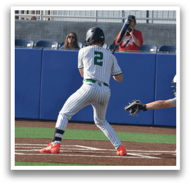 A baseball player is swinging a bat, attempting to hit a ball. The batter is wearing a white uniform and is in the process of making contact with the ball. The catcher is positioned behind the batter, ready to catch the ball if the batter misses. There are several other people in the scene, possibly teammates or opponents. AI generated content
