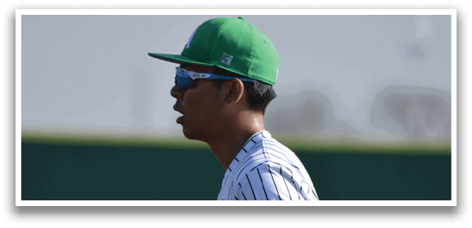 A baseball player wearing a green hat and a white and green striped shirt, holding a baseball glove. AI generated content