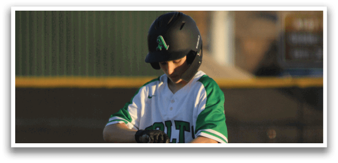 A young boy in a baseball uniform is standing on a base, holding a baseball bat. AI generated content