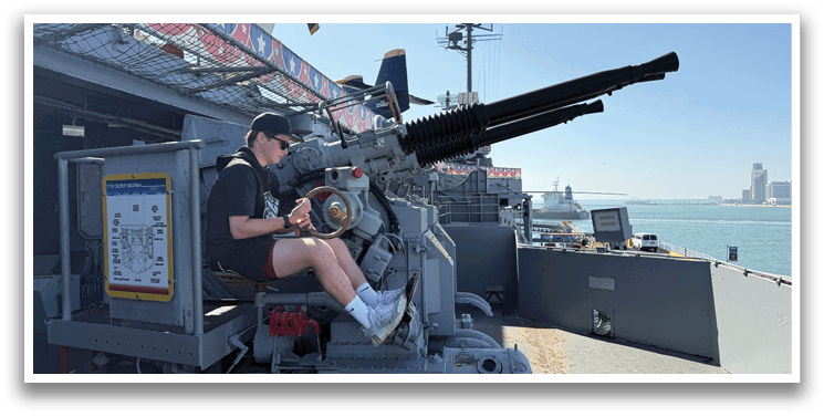 A man is sitting in a cannon on a boat. AI generated content
