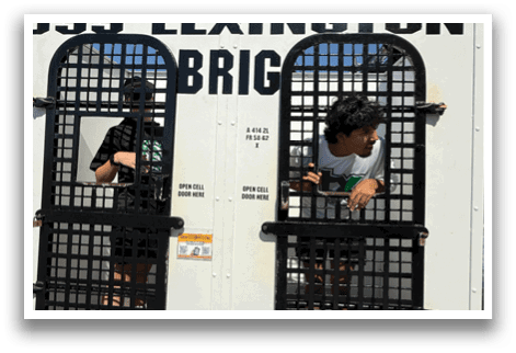 Two people are in a small, white, metal cage. AI generated content