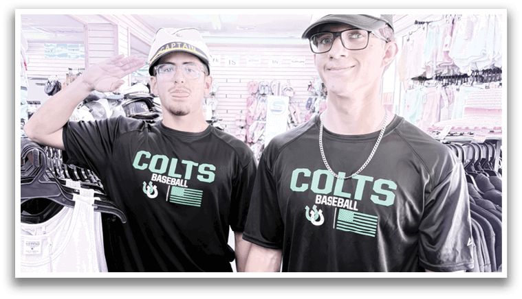 Two men wearing black shirts with the word “Colts" on them are standing in a store. AI generated content