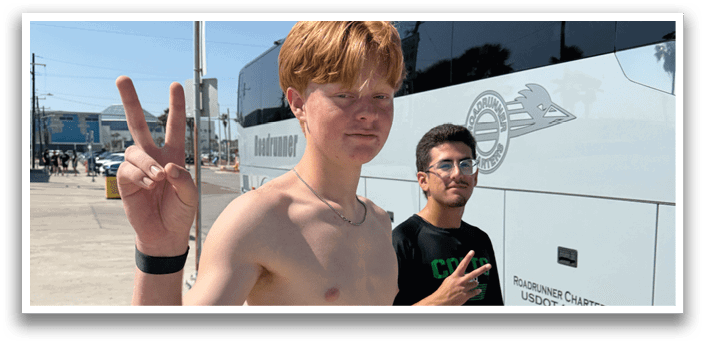 Two men are standing outside a bus, one of them is shirtless. AI generated content