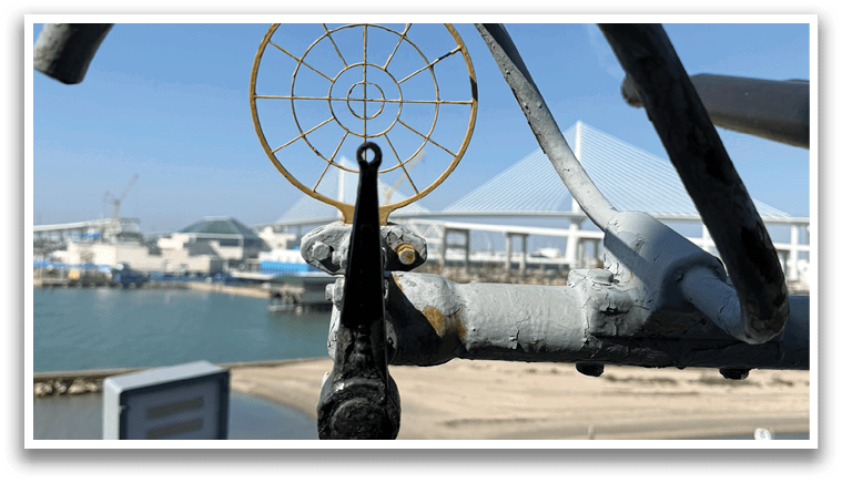 A metal object with a round hole in the center is attached to a metal pole. AI generated content