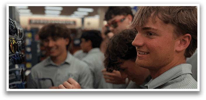 A group of young men are standing in a store, looking at sunglasses. AI generated content