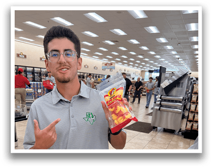A man in a grocery store holding a bag of chips. AI generated content