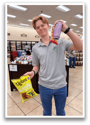 A man holding a can of soda and a bag of chips. AI generated content