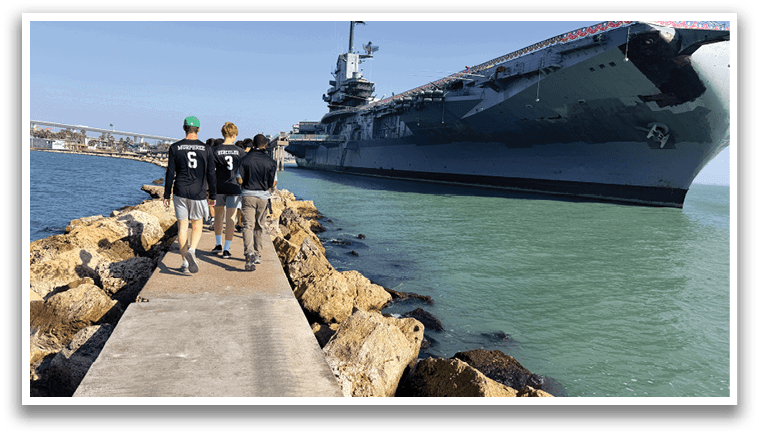 Three people are walking on a pier near a large ship. AI generated content
