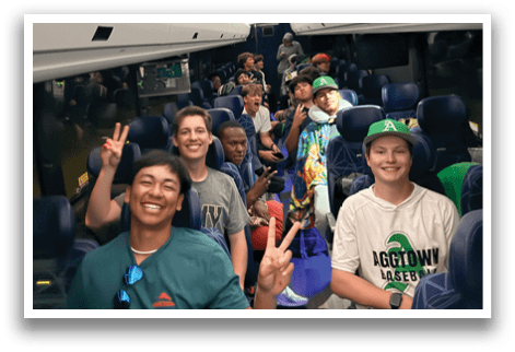 A group of people are sitting on a bus, smiling and enjoying their time together. AI generated content