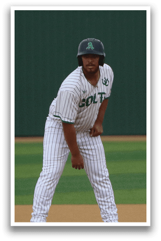 A baseball player wearing a helmet and a jersey with the letter A on it stands on a baseball field. AI generated content