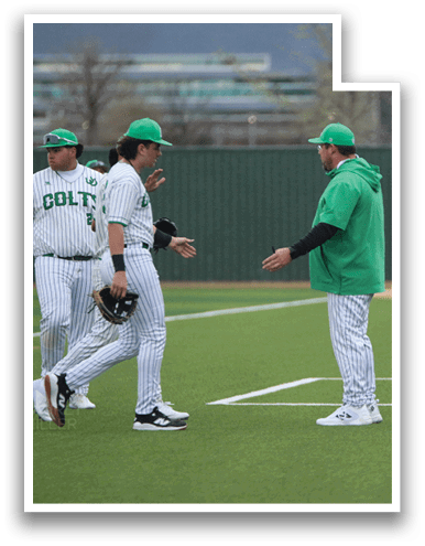 Three baseball players wearing green hats and white uniforms are standing on a field. They are shaking hands and talking to each other. AI generated content