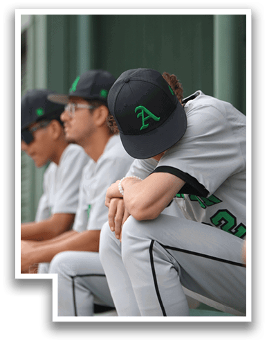 Three baseball players sitting on a bench, one of them wearing a hat with a green A on it. AI generated content
