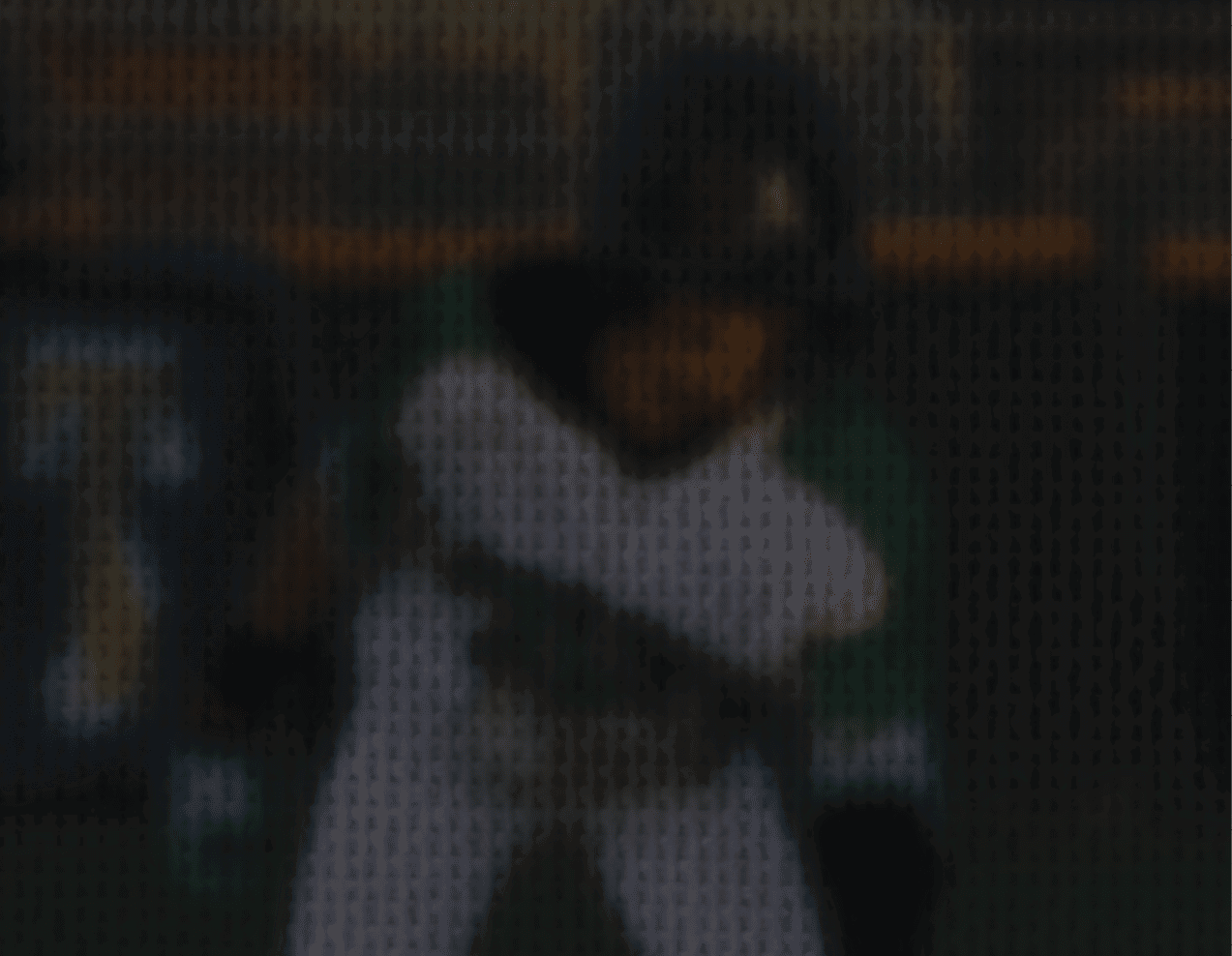 A baseball player is swinging a bat on a field. AI generated content